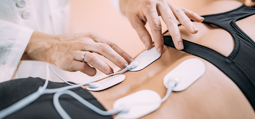 patient receiving electrical muscle stimulation in Tarrytown for auto accident injury relief